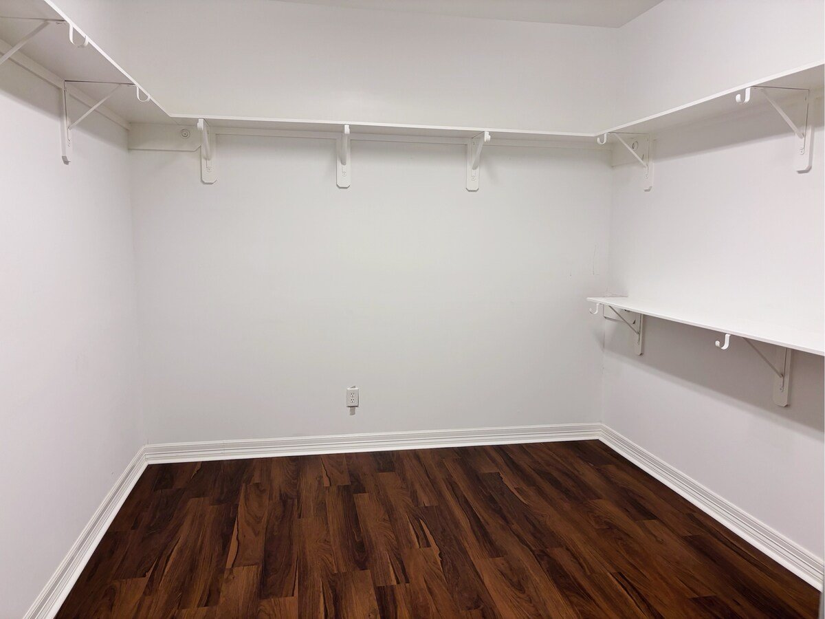 Spacious walk-in closet in master suite